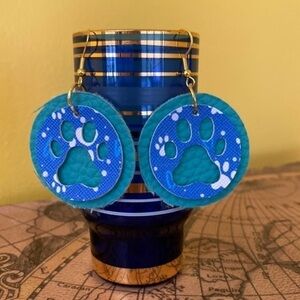 Hand crafted faux leather die cut paw print earrings.